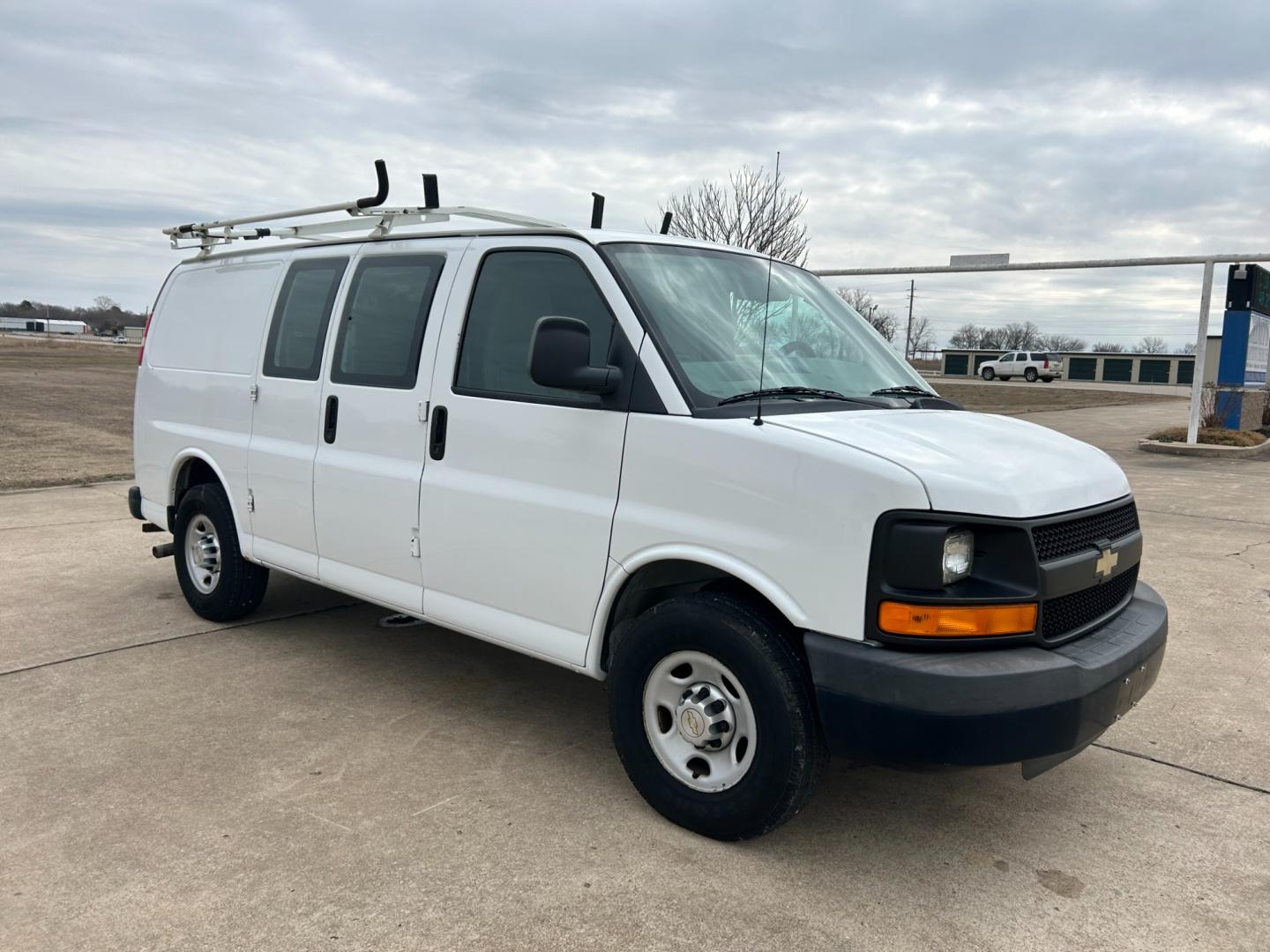 2012 White /Gray Chevrolet Express 2500 Cargo (1GCWGFCB4C1) with an 6.0L V8 OHV 16V FFV engine, 6-Speed Automatic transmission, located at 17760 Hwy 62, Morris, OK, 74445, (918) 733-4887, 35.609104, -95.877060 - 2012 CHEVROLET EXPRESS CARGO VAN 6.0L V8 RWD FEATURING MANUAL LOCKS, MANUAL WINDOWS, MANUAL MIRRORS, MANUAL SEATS, AM/FM STEREO, LEATHER SEATS, LEATHER-WRAPPED STEERING WHEEL, TRACTION CONTROL, LOCKING METAL CONSOLE, STEEL SHELVES, SPLIT SWING-OUT RIGHT DOORS, RUBBER MATS, LOAD-BEARING EXTERIOR RACK - Photo#2